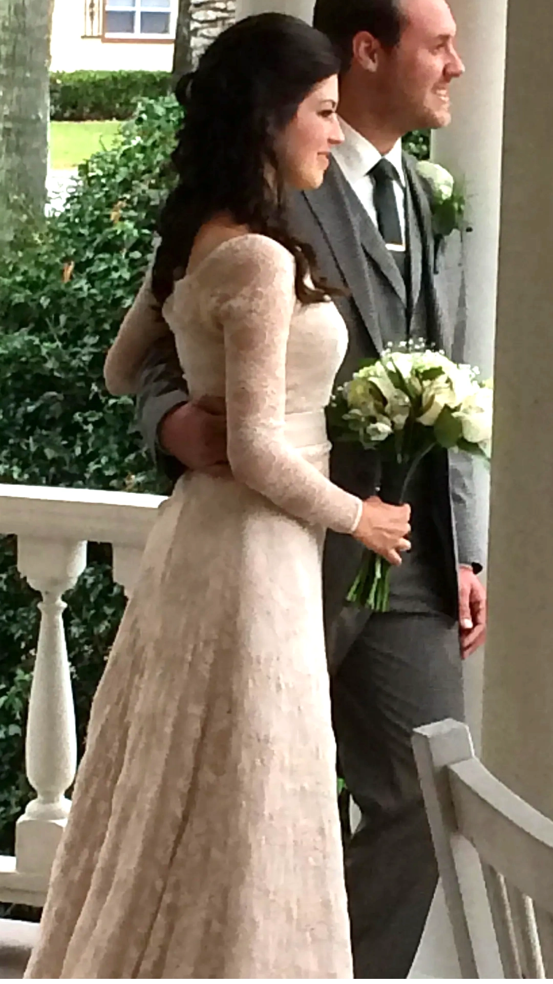 Bride in a beautifully fitted custom wedding gown